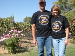 Steve and Viki with their vineyard in the background Steve and Vicki with their vineyard in the background