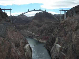View of the river from the Hoover Dam with new the bridge being constructed over it View of the river from the Hoover Dam with new the bridge being constructed over it
